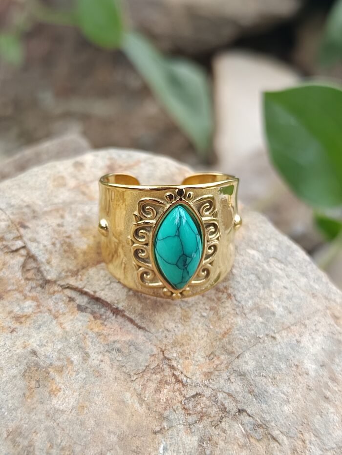 anillo dorado piedra turquesa