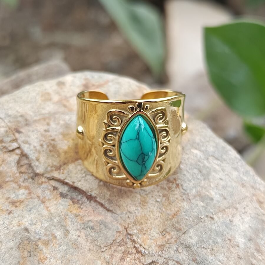 anillo dorado piedra turquesa